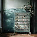 A vintage 6-drawer chest dresser features ReDesign with Prima's Siren's Serenity A1 Fiber paper on the front.
