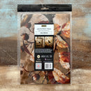 Packaging of decoupage fiber with autumn leaf design on a textured surface