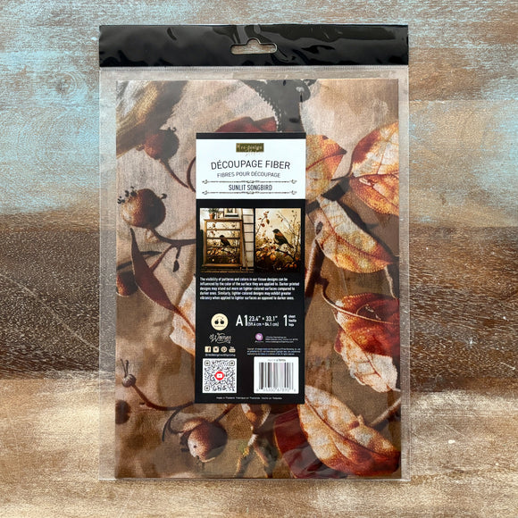 Packaging of decoupage fiber with autumn leaf design on a textured surface