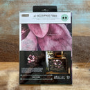 A package of ReDesign with Prima's Violet Bloom A1 Fiber Paper is against a wood background.