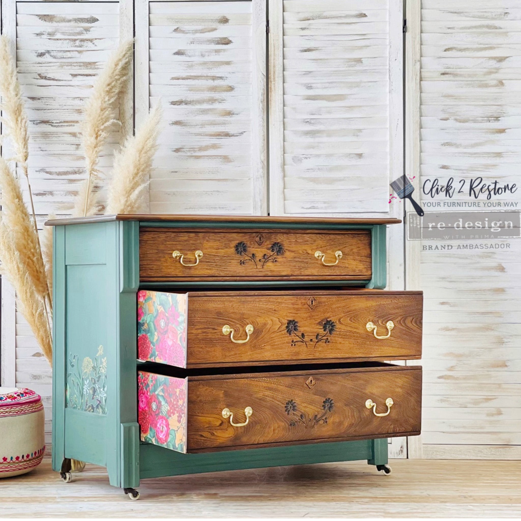 A 3-drawer dresser refurbished by Click 2 Restore is painted a soft blue green with natural wood drawers and features ReDesign with Prima's Earthly Delights on the sides of the drawers.