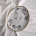 A small white plate with a gold border features the Blossomy H2O trasnfer on it.