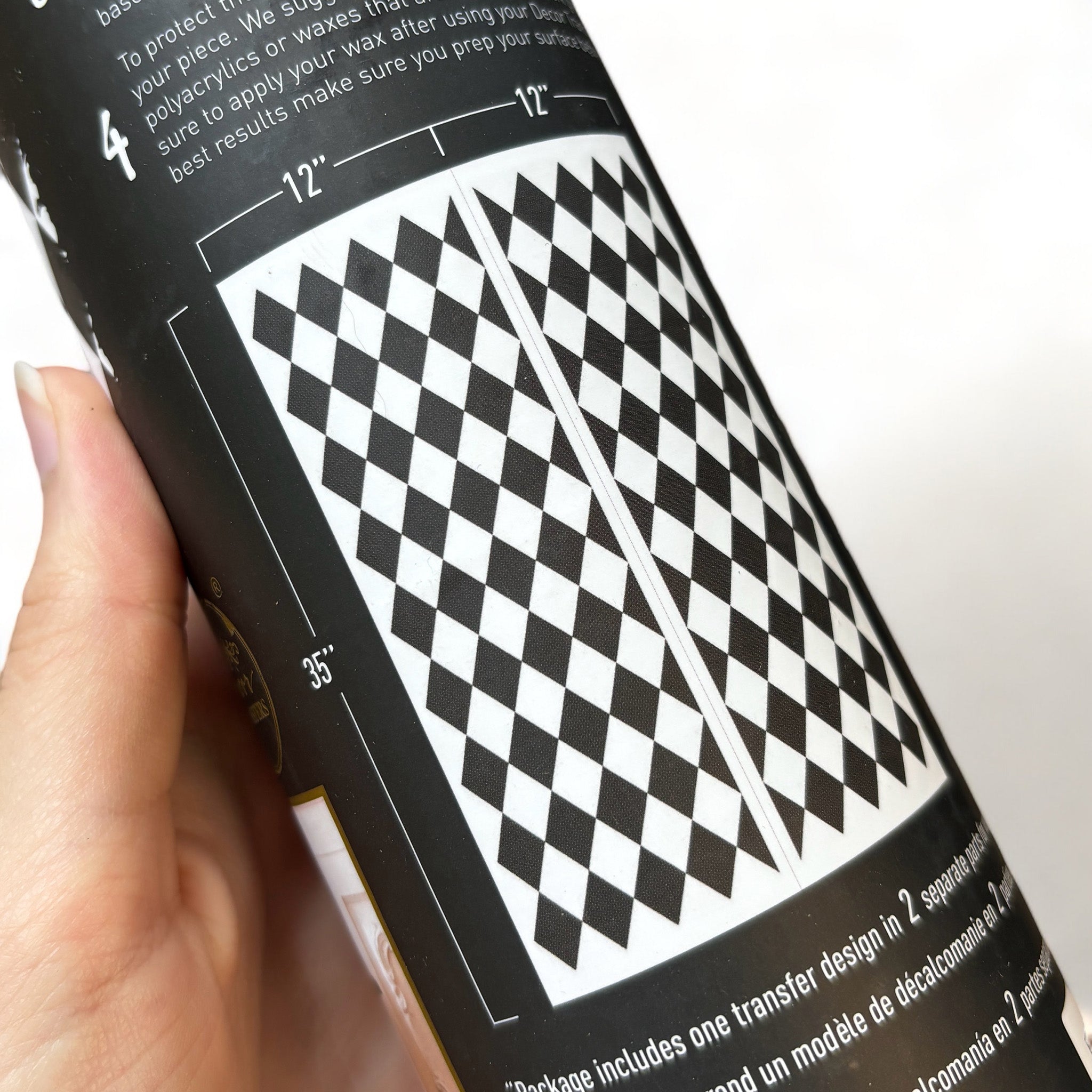 A tube of ReDesign with Prima's Harlequin rub-on transfer shows 2 sheets with measurements of 12" x 35" each.