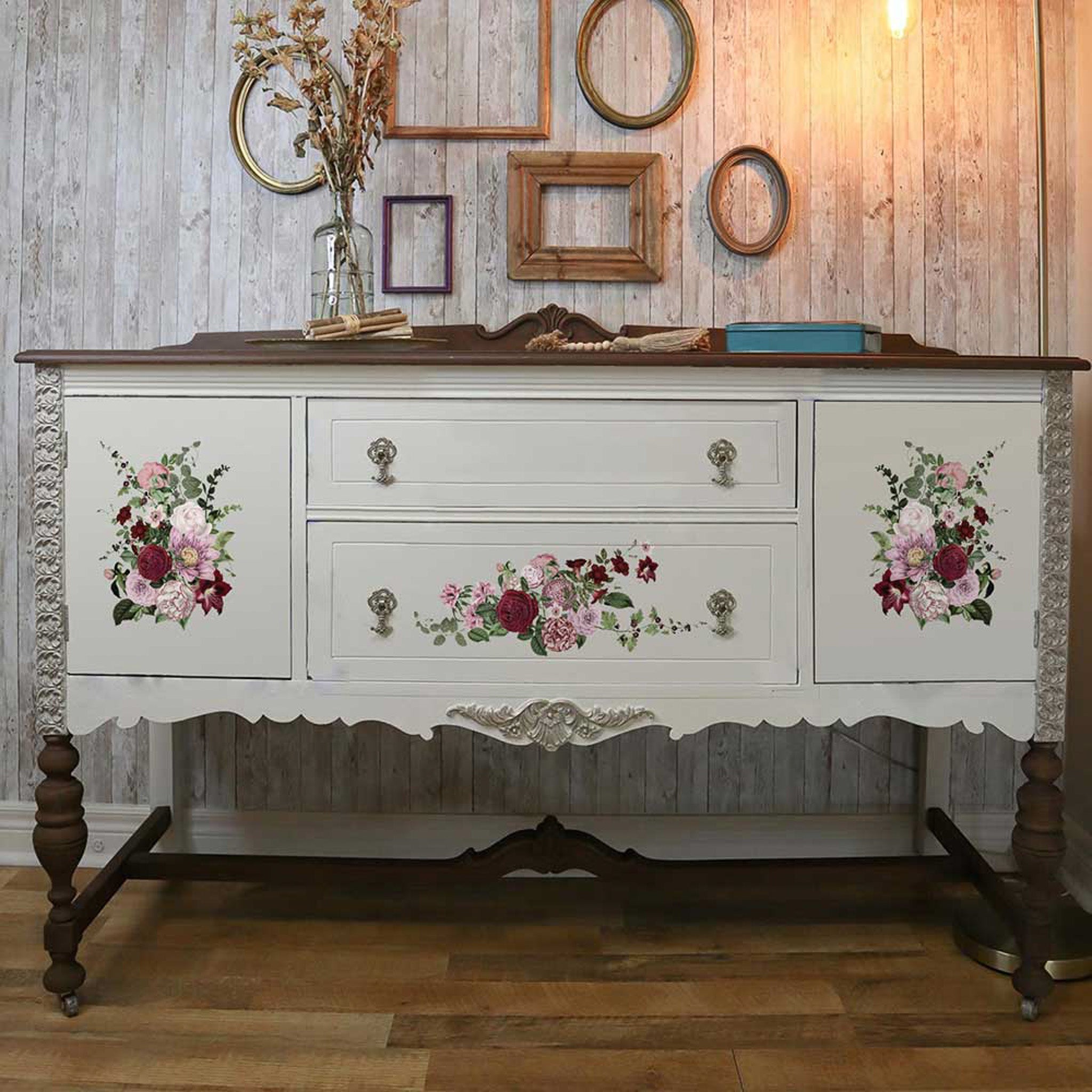 A vintage console table is painted soft white with a natural wood top and legs and fetures ReDesign with Prima's Very Purple small transfers on it.