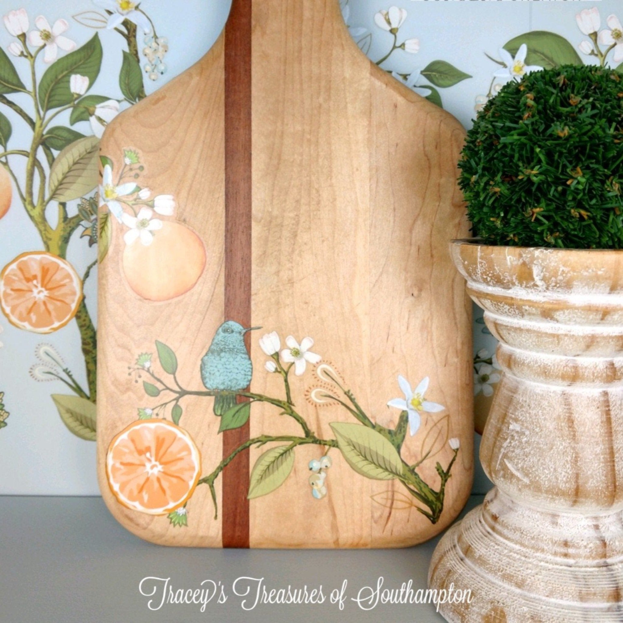 A wood paddle cutting board refurbished by Tracey's Treasures of Southampton features ReDesign with Prima's Orange Grove transfer on it.