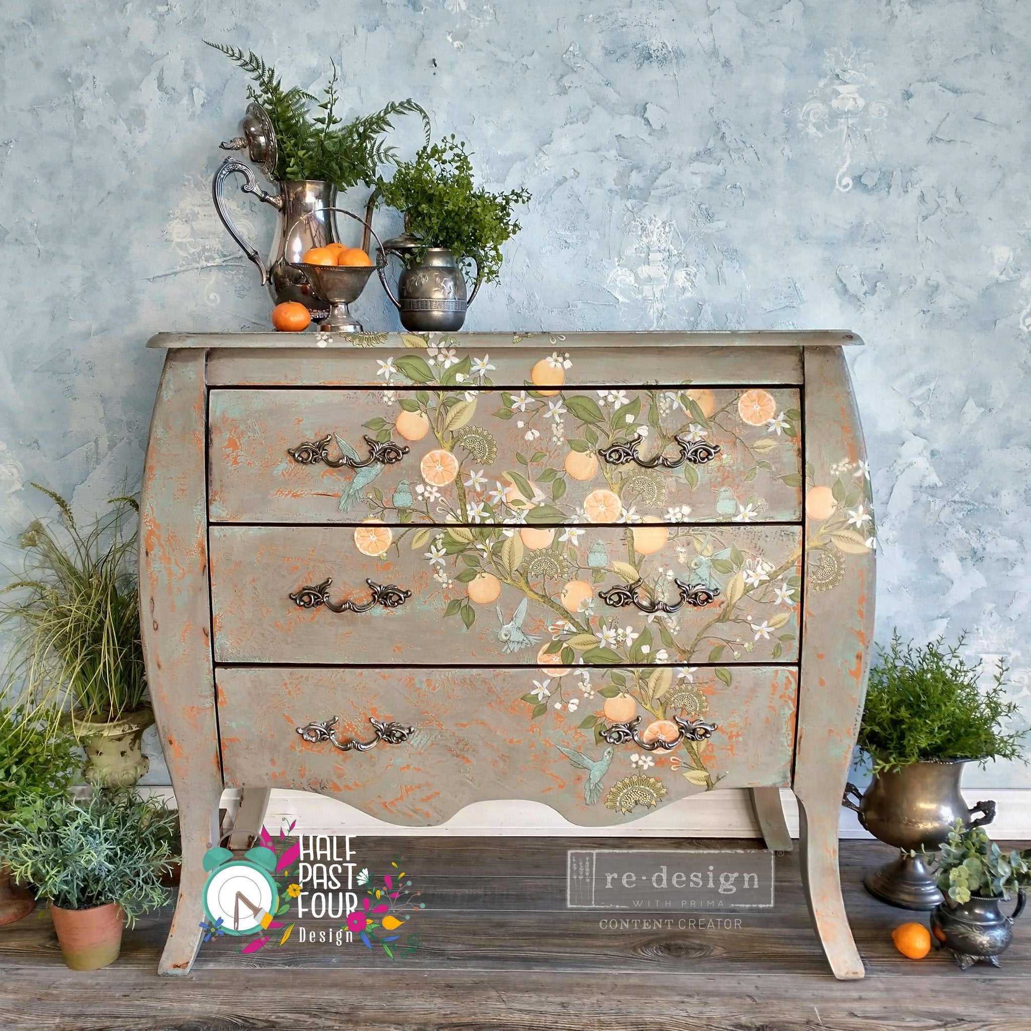 A vintage Bombay 3-drawer dresser refurbished by Half Past Four Design is painted light brown and features ReDesign with Prima's Orange Grove transfer on the front.