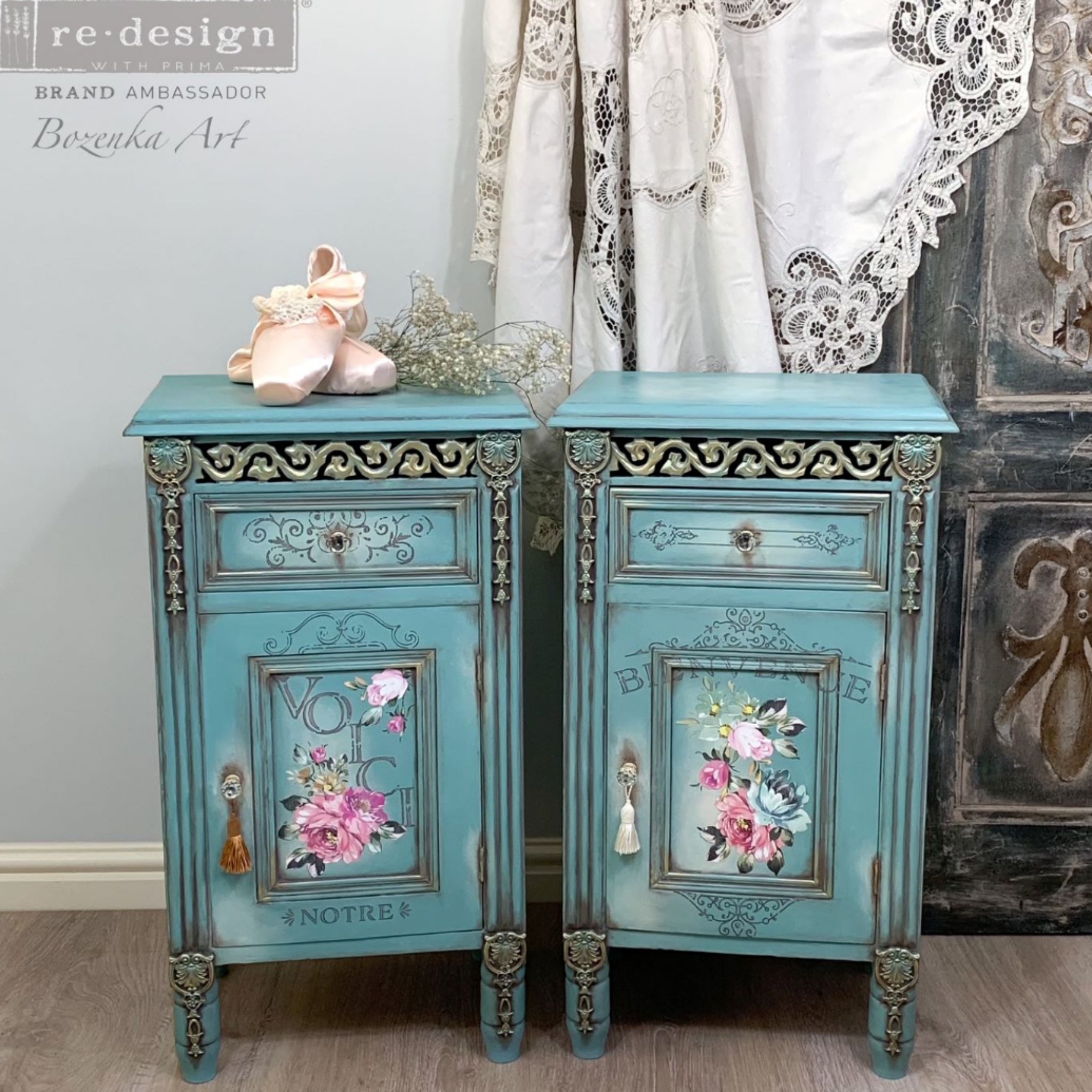 Two vintage nightstands with storage refurbished by Bozenka Art are painted light blue and feature ReDesign with Prima's Fuchsia Sunset rub on transfer on them.