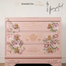 Blushing Blooms Symphony by KACHA transfer used on a blush pink dresser—corner rose clusters framing drawers with ornate gold pulls and vintage script accents.