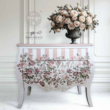 ReDesign with Prima Blushing Blooms Symphony furniture transfer on a white chest with blush-and-white striped drawer—full floral pattern across the front with pink roses and greenery.
