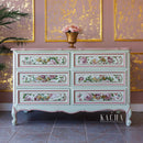 Blushing Blooms Symphony by KACHA furniture transfer applied to a mint green dresser with pink trim and gold hardware—romantic rose florals on drawer fronts.