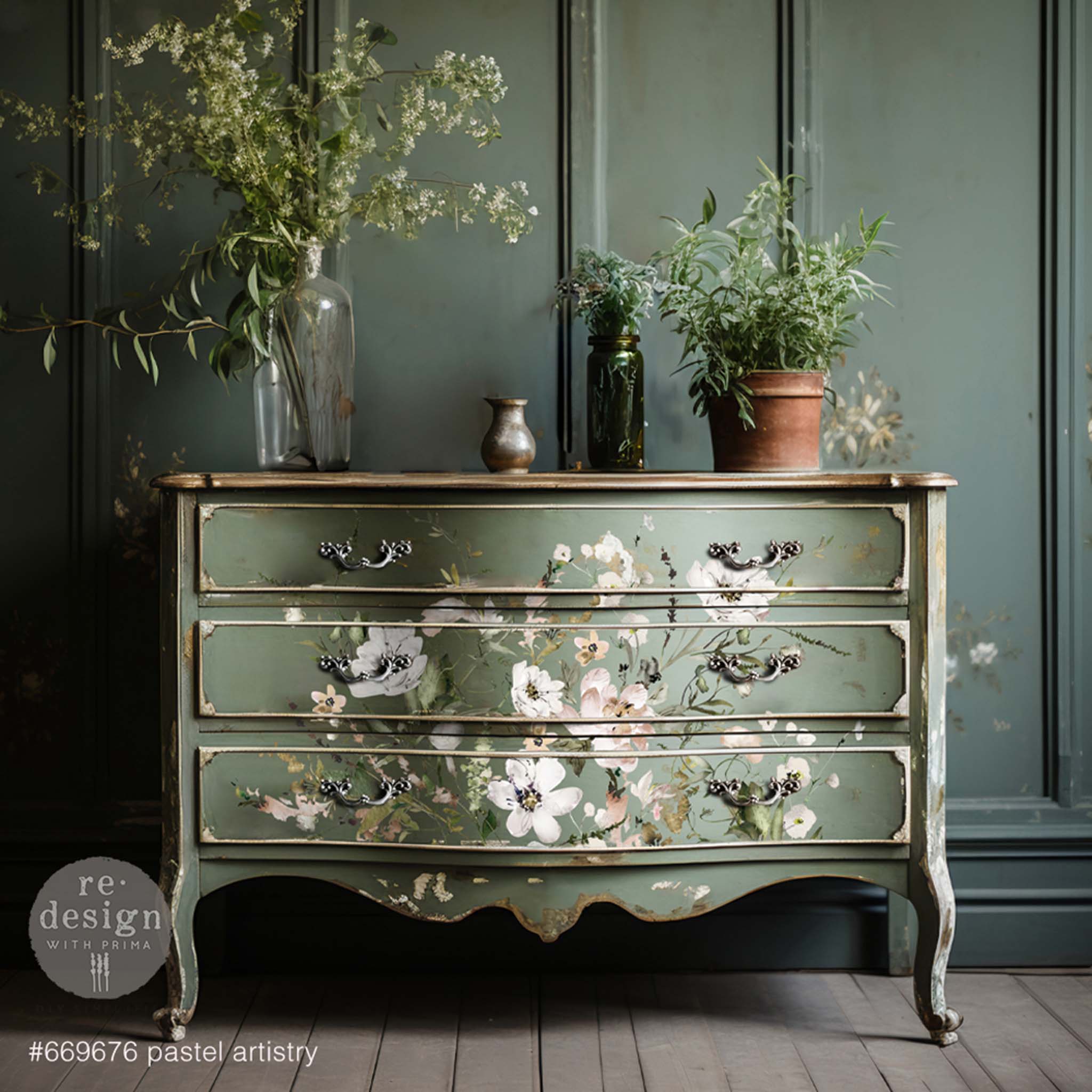 A vintage 3-drawer dresser is painted sage green and features ReDesign with Prima's Pastel Artistry transfer on the drawers.