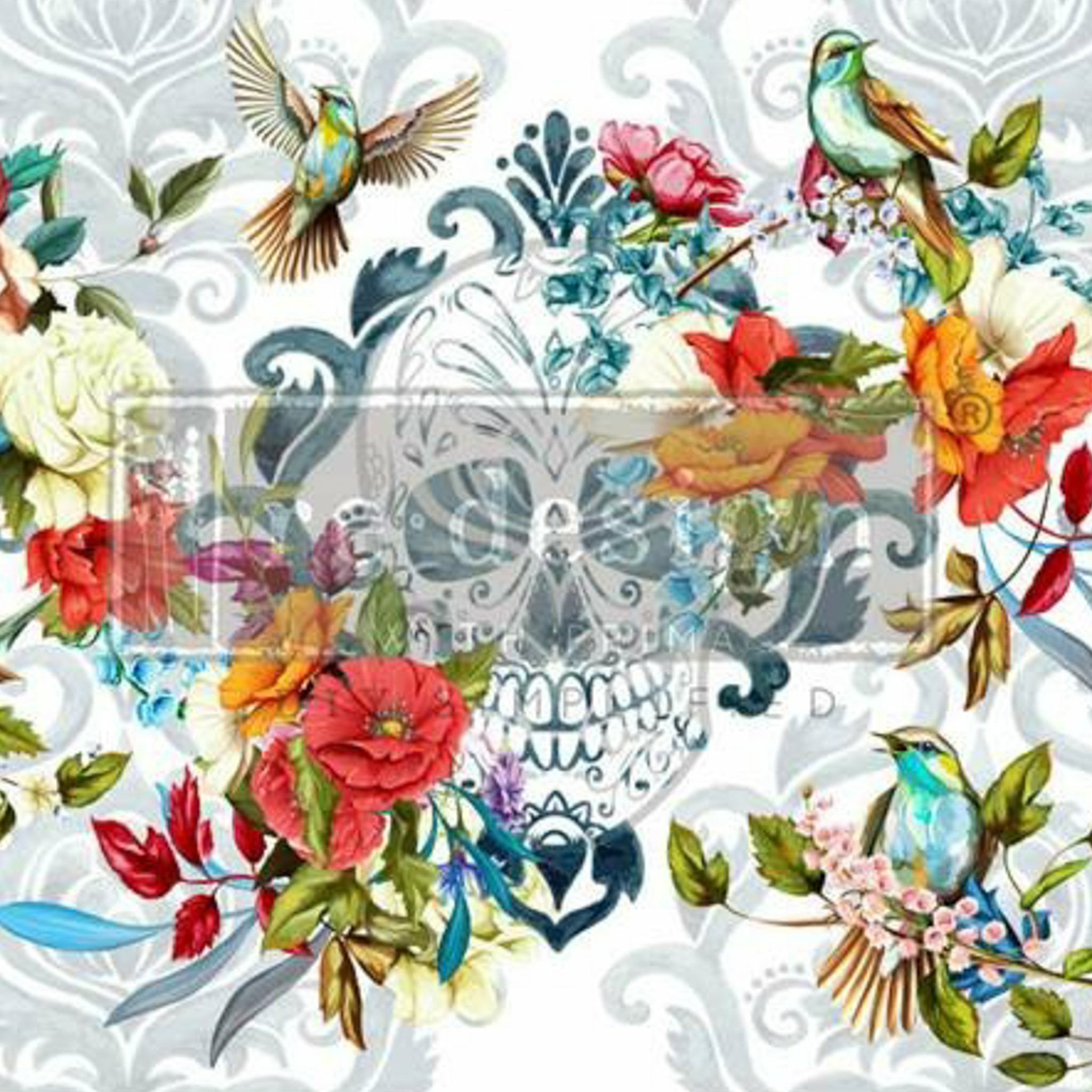 A close-up of a rub on transfer features a sugar skull, vibrant flowers and birds, and a subtle grey floral damask background.