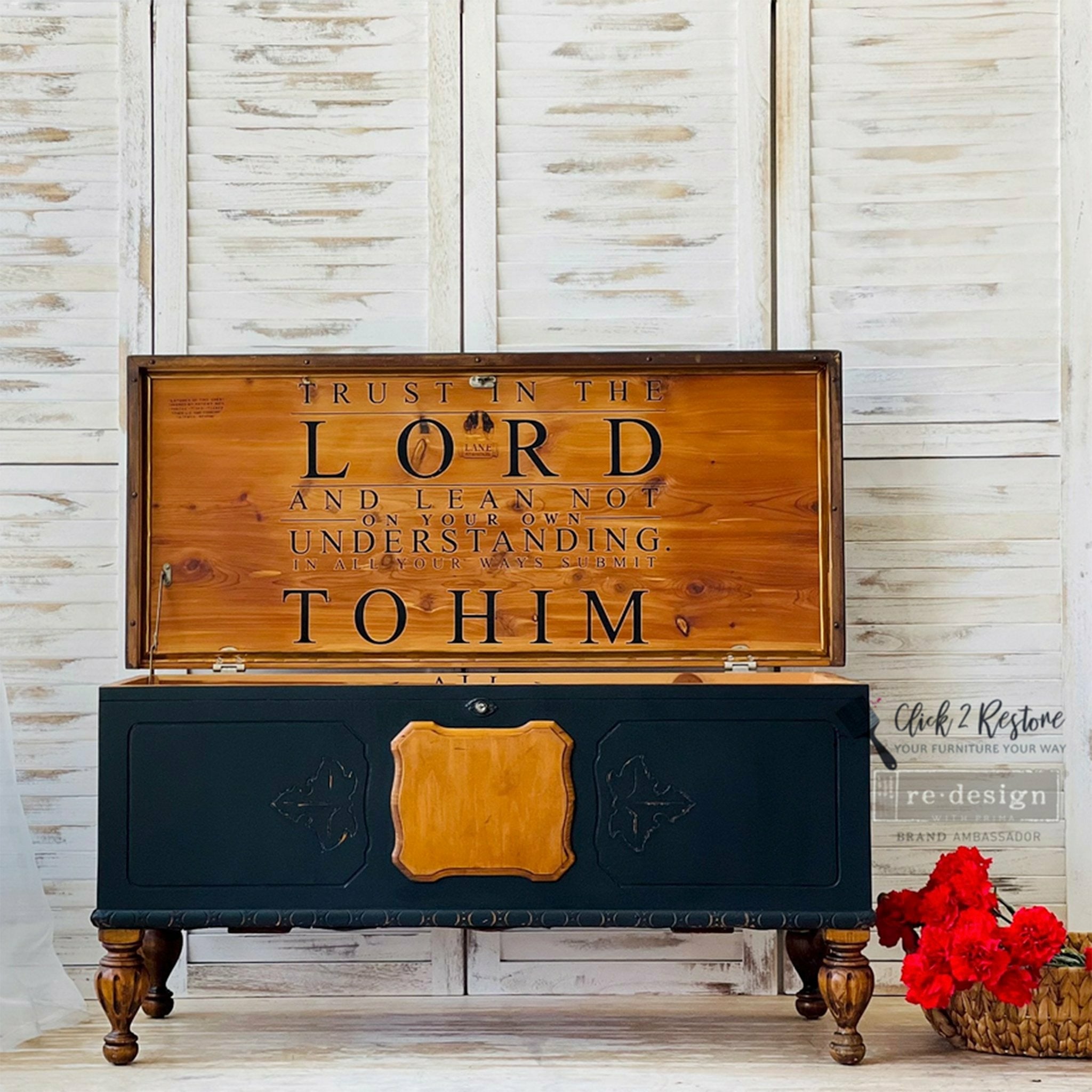 A vintage wood chest refurbished by Click 2 Restore is painted navy blue and features ReDesign with Prima's Trust in the Lord transfer inside the lid against stained natural wood.