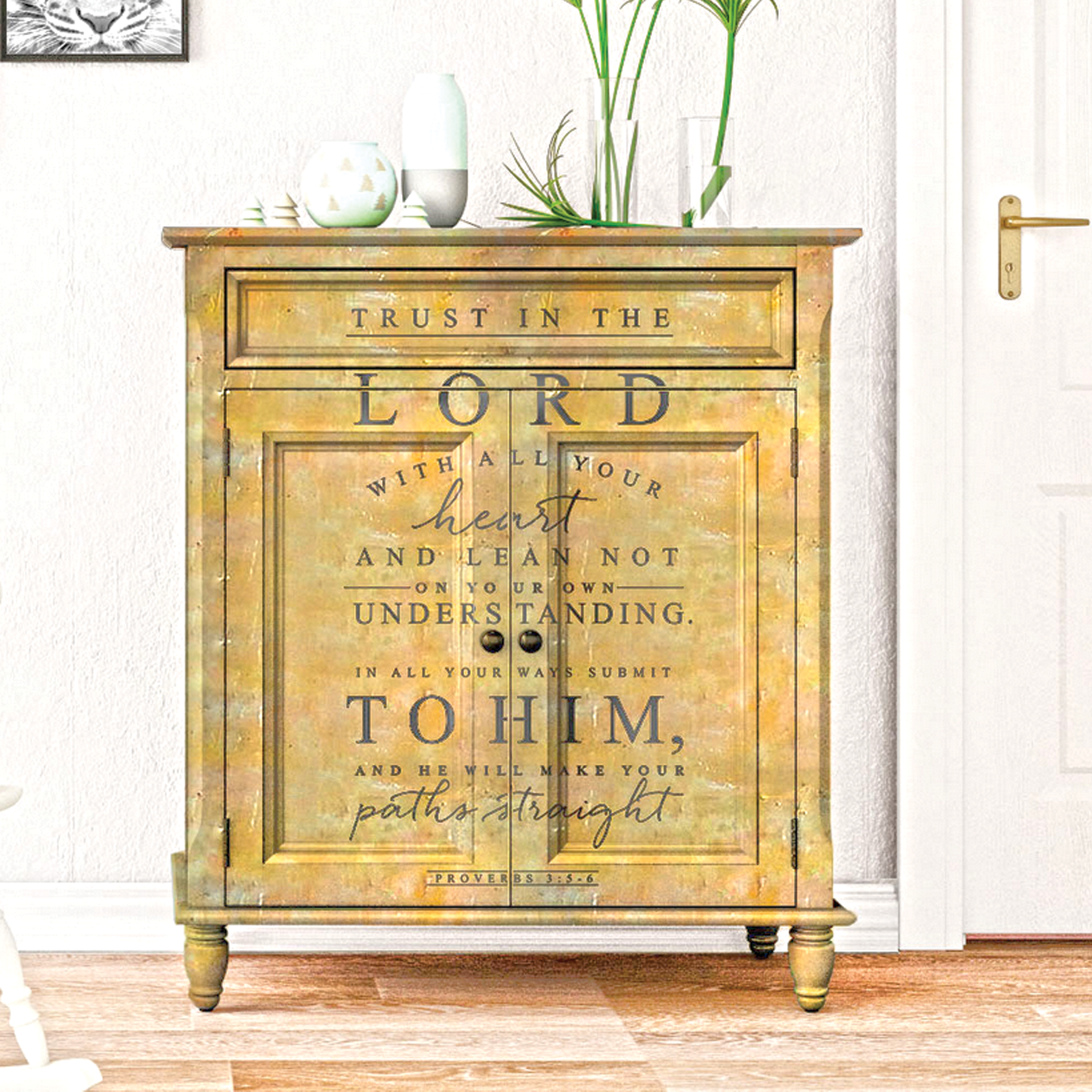 A vintage small buffet cabinet is painted a mottled mustard yellow and features ReDesign with Prima's Trust in the Lord transfer on the front.