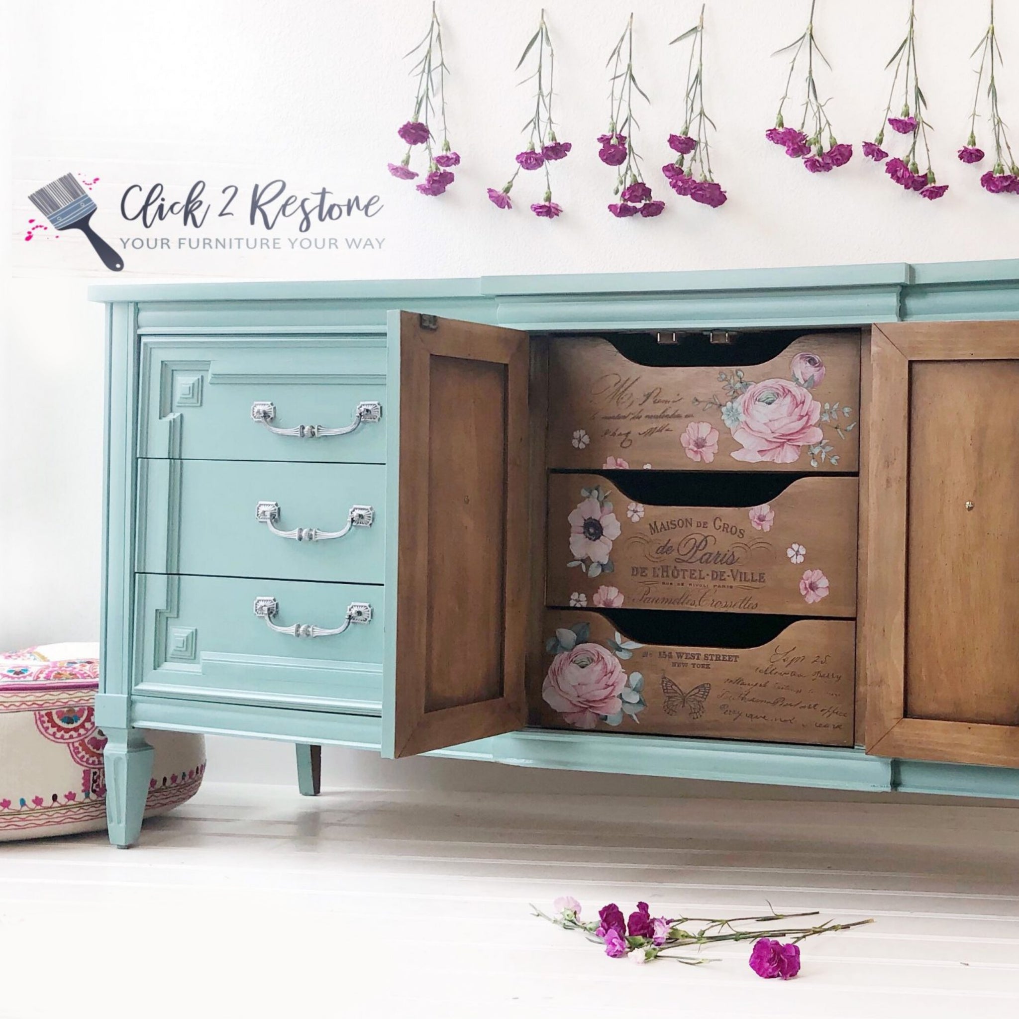 A vintage buffet table refurbished by Click 2 Restore is painted light sky blue and features ReDesign with Prima's Overflowing Love transfer inside 2 doors on 3 natural wood drawers.