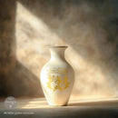 A white ceramic vase features ReDesign with Prima's Gilded Memories H2O Water Slide Transfer on it.