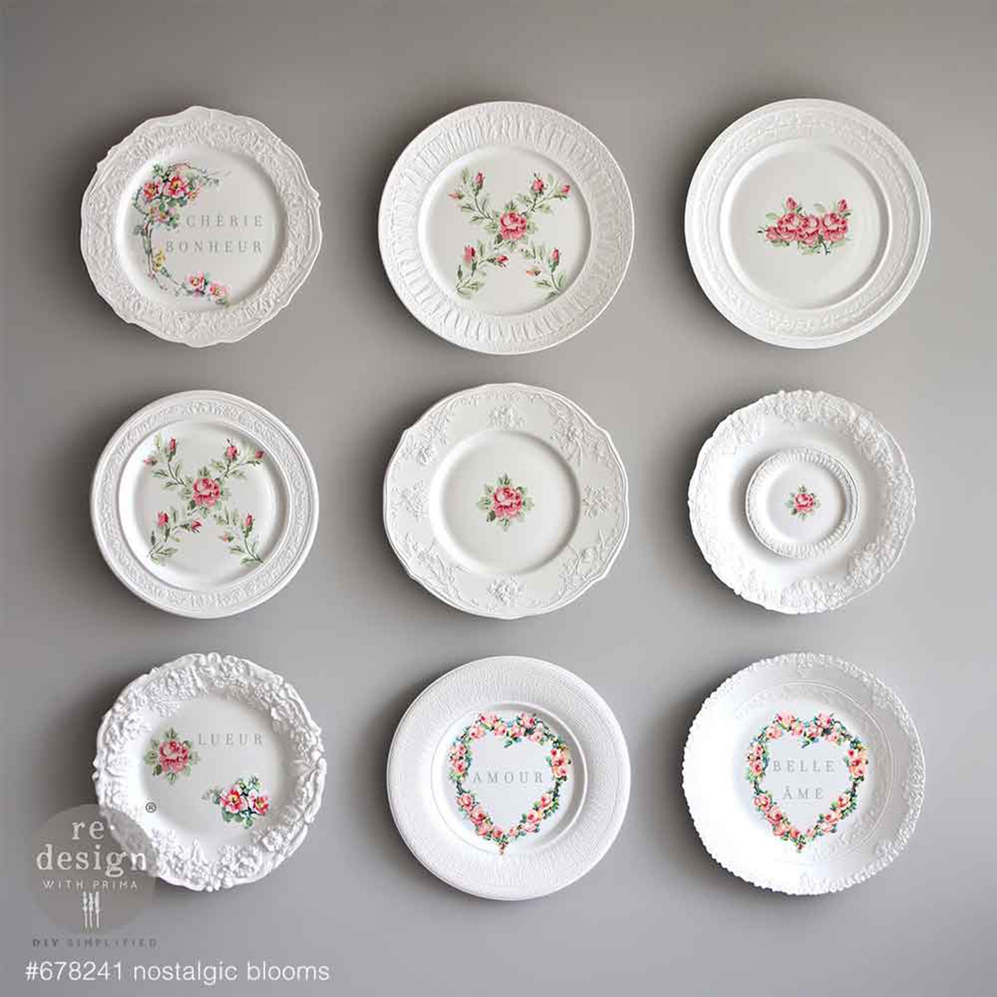 Nine small white plates feature ReDesign with Prima's Nostalgic Blooms H2O Water Slide Transfers on them.