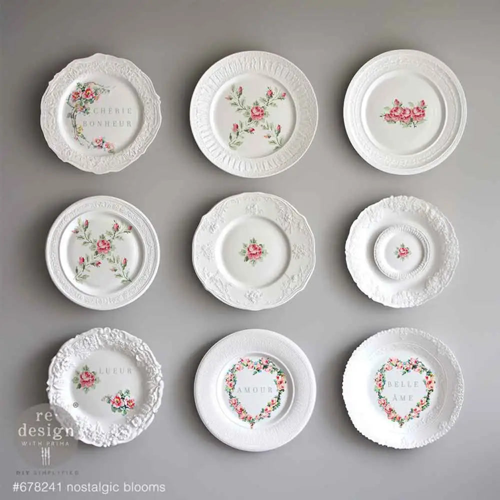 Nine small white plates feature ReDesign with Prima's Nostalgic Blooms H2O Water Slide Transfers on them.