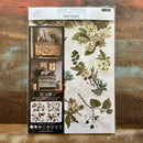 A package of ReDesign with Prima's Aviary Elegance rub-on furniture transfer is against a wood background.