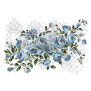 A rub-on transfer featuring a large floral arrangement of blue flowers against a faint damask pattern is against a white background.