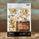 A package of ReDesign with Prima's Belle Epoque Blooms middy rub-on transfer is against a wood background.