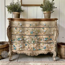 A vintage 4-drawer chest dresser is painted beige and features ReDesign with Prima's Blue Vine rub-on furniture transfer on it.