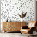 A natural wood mid-century modern TV console features ReDesign with Prima's Blue Vine rub-on furniture transfer on the left front.