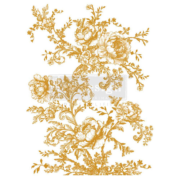 Decorative gold floral design on a white background