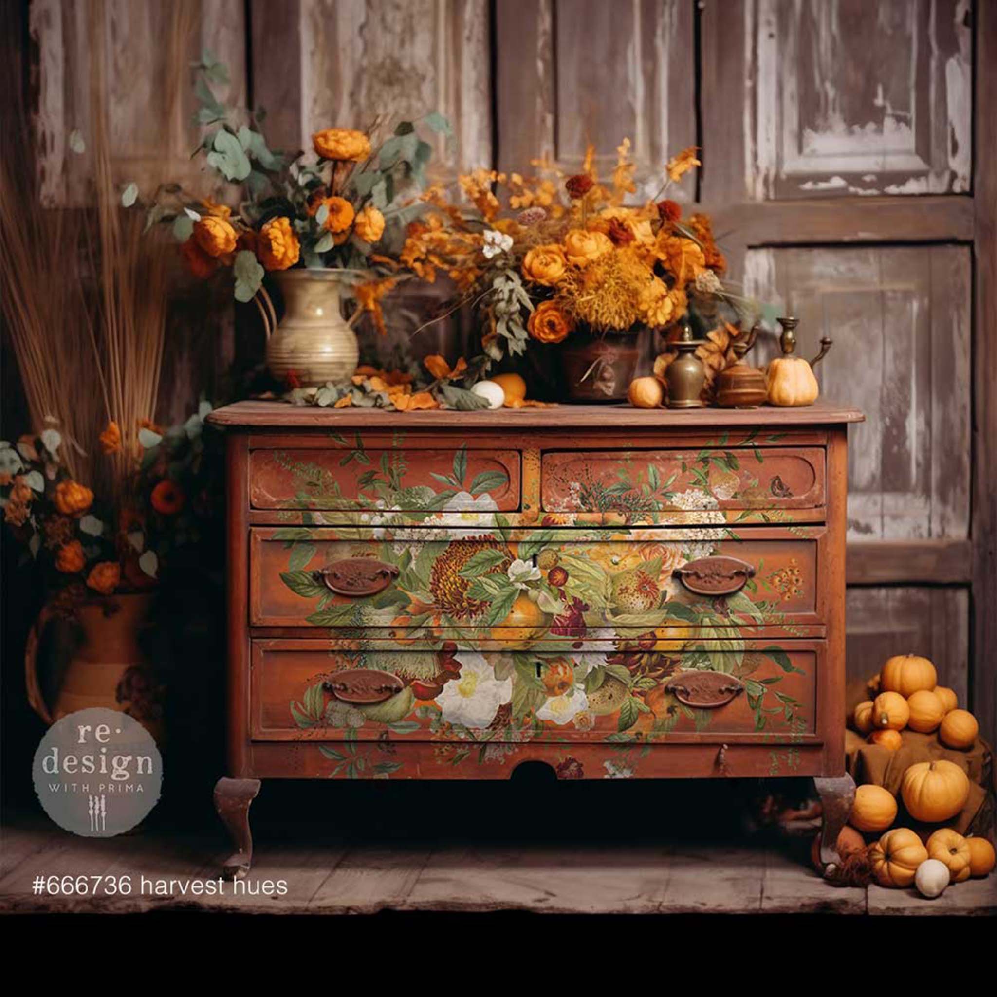 A vintage dresser is painted rust red and features ReDesign with Prima's Harvest Hues transfer on it.