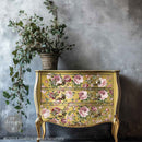 A vintage 3-drawer dresser is painted golden yellow and features ReDesign with Prima's Kacha Blushing Blooms Symphony Transfer for furniture on the drawers.