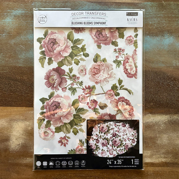 A package of ReDesign with Prima's Kacha Blushing Blooms Furniture Transfer is against a wood background.