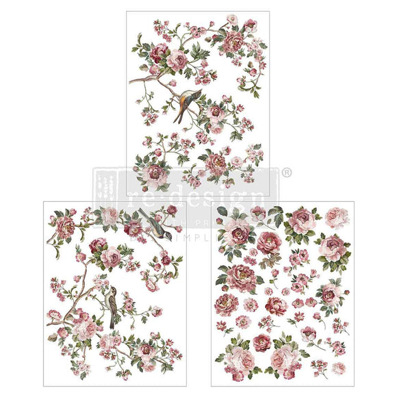 Three sheets of small rub-on transfers featuring pink and mauve roses with birds amongst them are against a white background.
