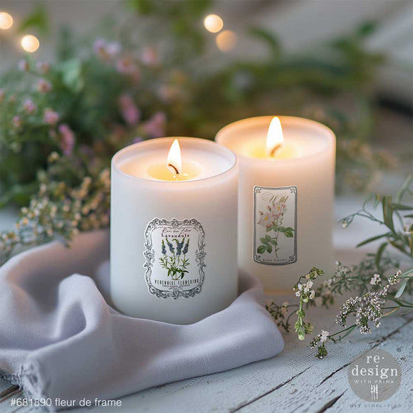 White candles decorated with lavender and wildflower vintage labels from Fleur de Frame Luxe Transfers