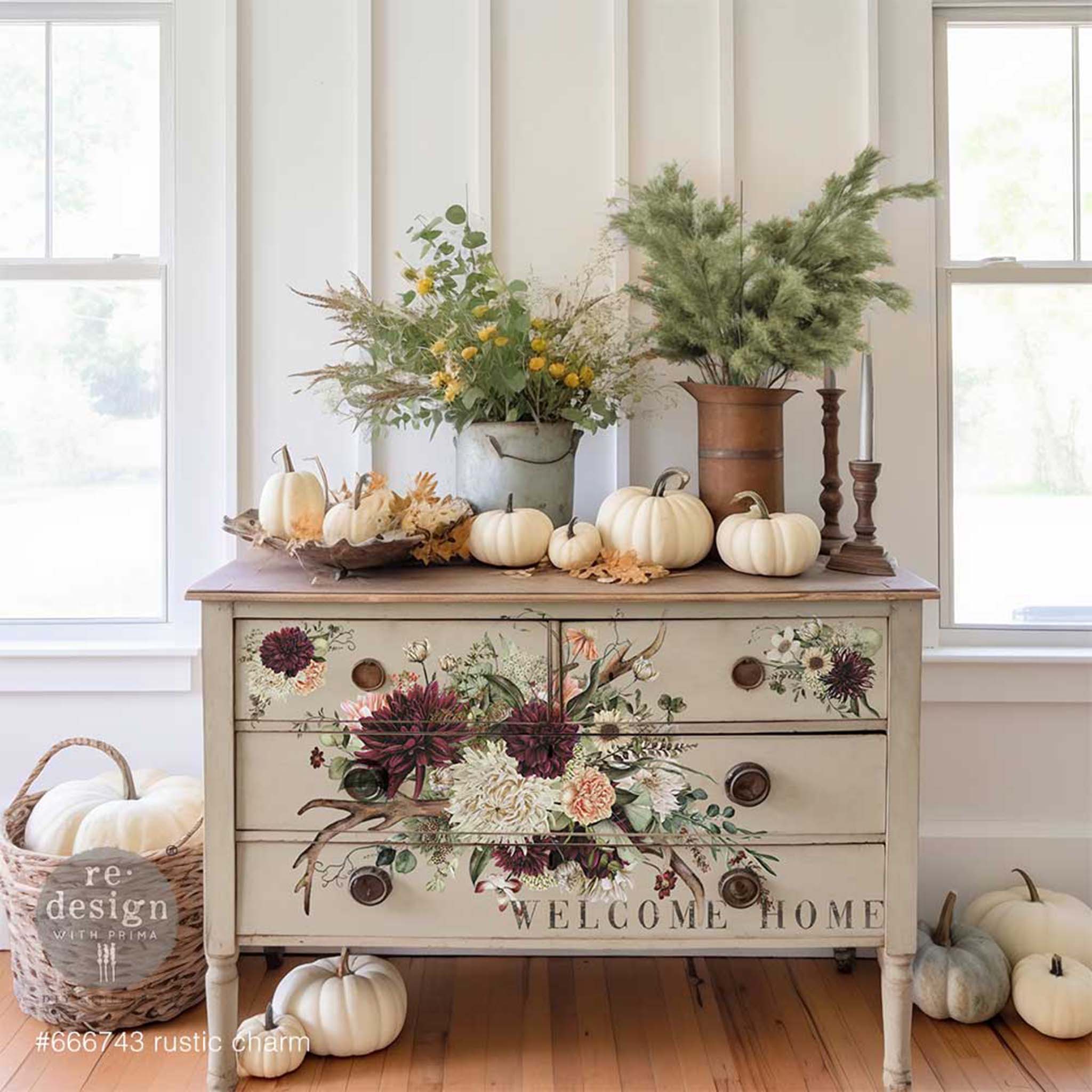 A 4 drawer dresser is painted beige and features ReDesign with Prima's Rustic Charm furniture transfer on its drawers.