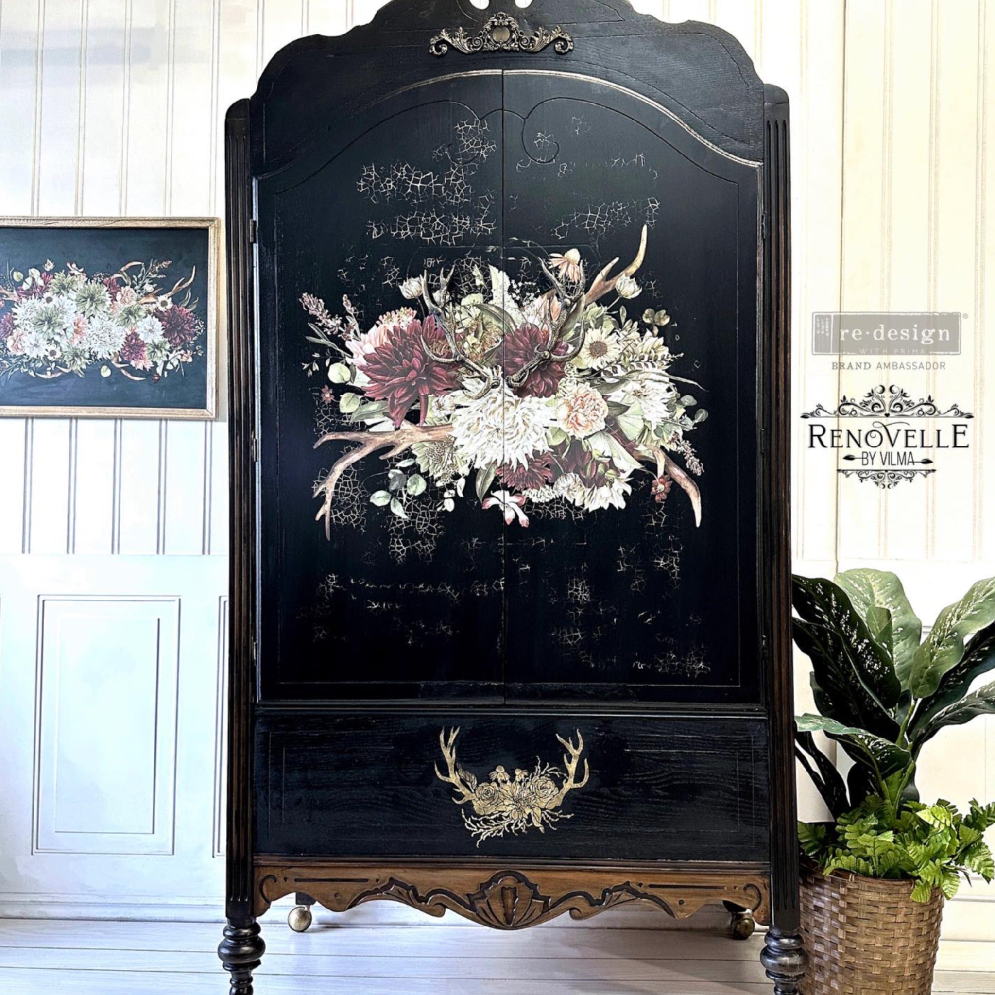 A large armoire refurbished by Renovelle by Vilma is painted black and features ReDesign with Prima's Loggers Lodge silicone moulds on its bottom front panel. ReDesign with Prima's Rustic Charm furniture transfer is also featured on the doors of the armoire.