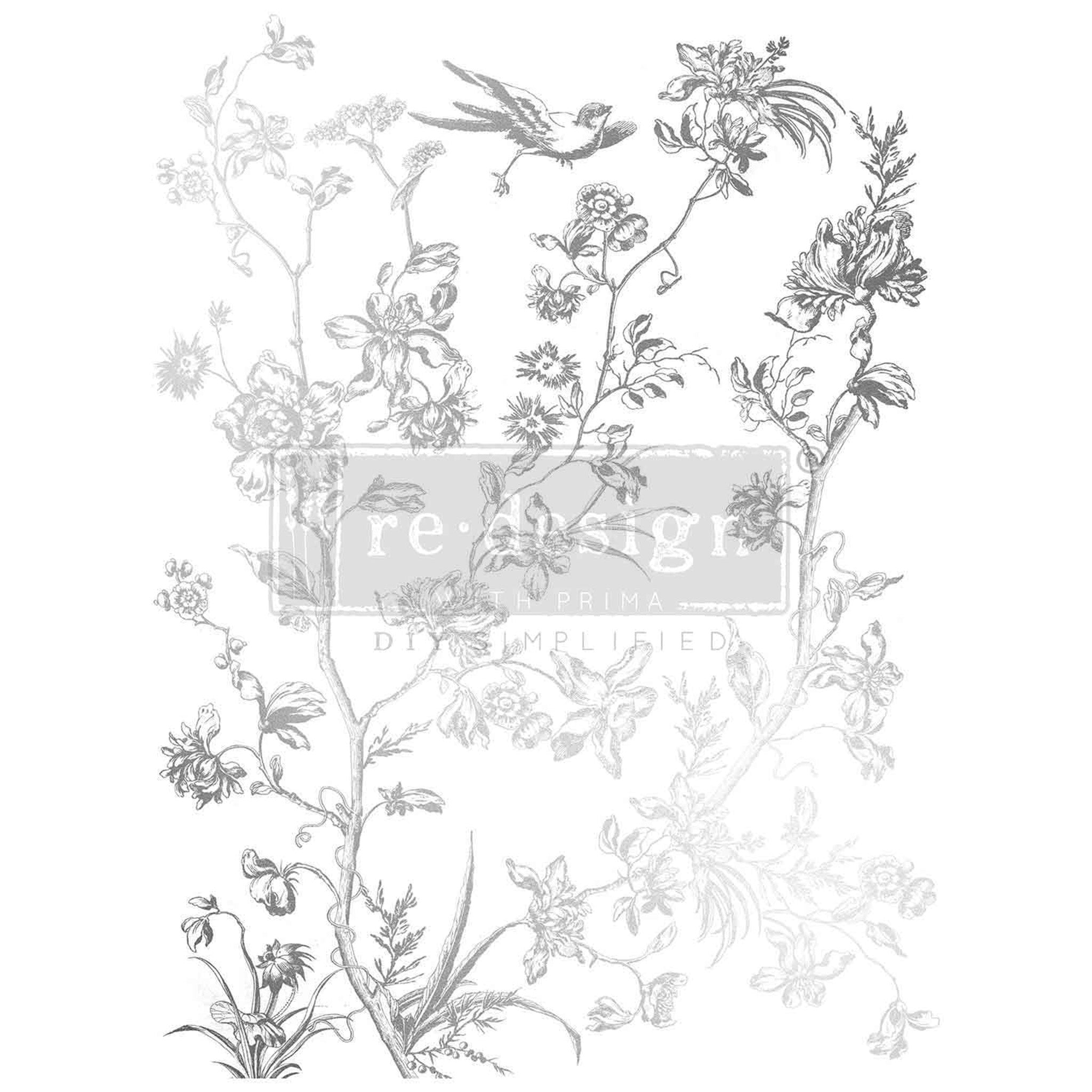 Rub on transfer design featuring delicate, flowering branches and a bird, all in a beautiful silver foil finish is against a white background.