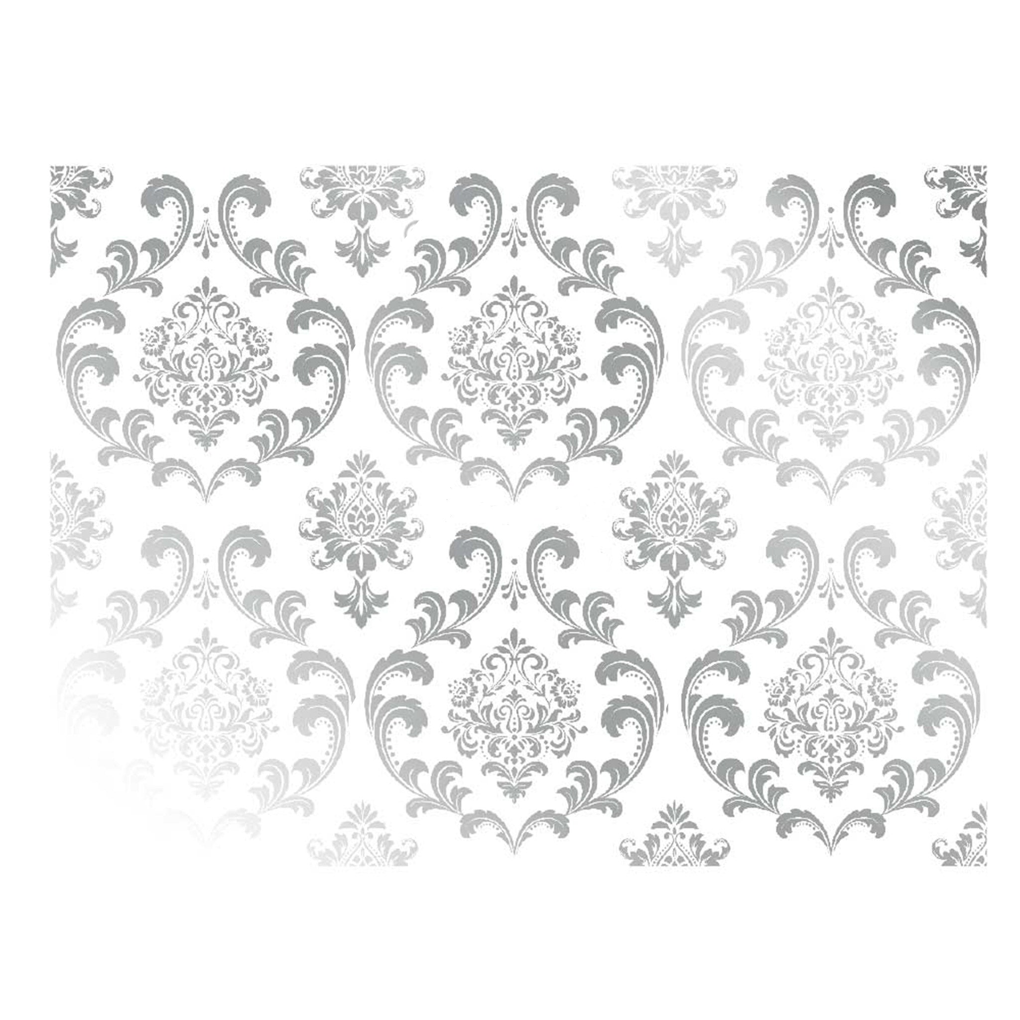 Rub on transfer featuring a repeating ornate damask design in silver foil is against a white background.