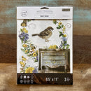 A package of ReDesign with Prima's Sunlit Aviary small rub-on transfers is against a wood background.