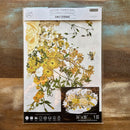 A package of ReDesign with Prima's Sunlit Serenade Furniture Transfer is against a wood background.