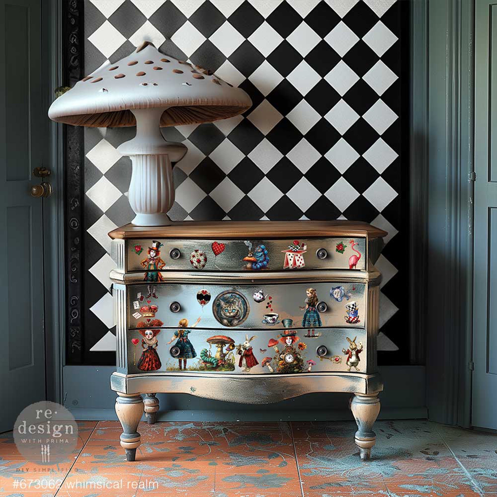 A vintage 3-drawer dresser is painted a blend of bronze and silver metallic paints and features ReDesign with Prima's Whimsical Realm small rub on transfers on the drawers.