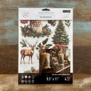 A package of ReDesign with Prima's Yuletide Nostalgia middy rub-on transfers are against a wood background.