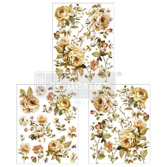 Three sheets of small rub-on transfers featuring soft yellow roses and vibrant greenery are against a white background.