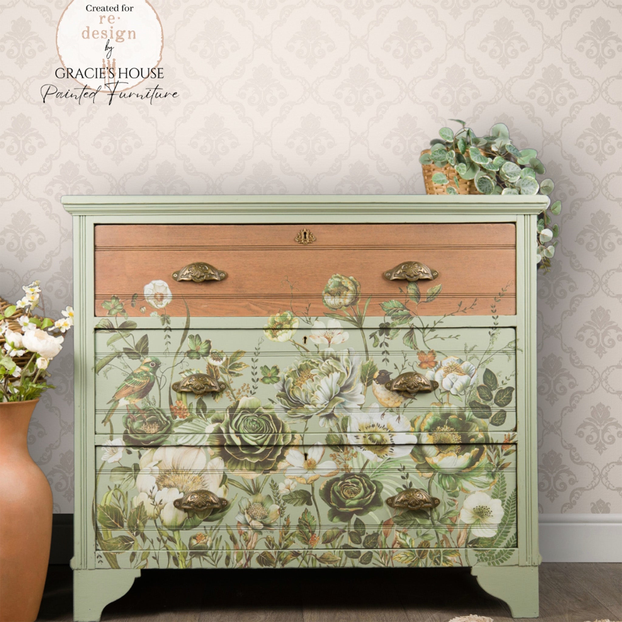 A 3-drawer dresser refurbished by Gracie's House Painted Furniture is painted spring green and features ReDesign with Prima's Botanical Journal rub-on transfer on the drawers. The top drawer is natural wood.