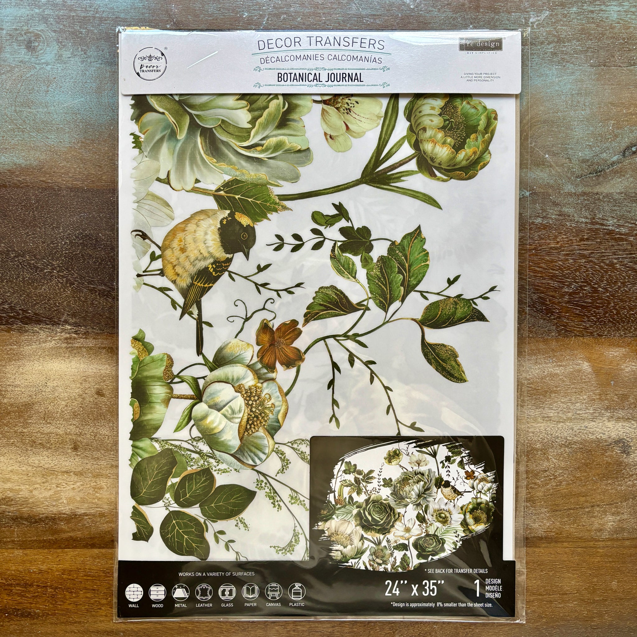 A package of ReDesign with Prima's Botanical Journal rub-on furniture transfer is against a wood background.