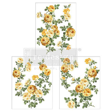Three sheets of small rub-on transfers that feature sunny yellow roses and lush greenery are against a white background.