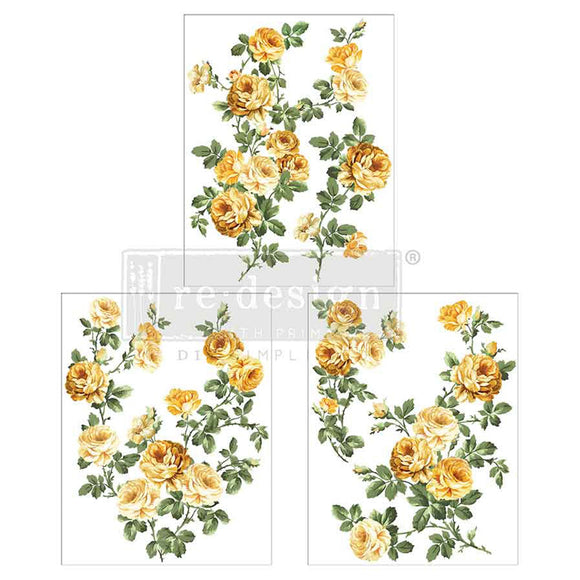 Three sheets of small rub-on transfers that feature sunny yellow roses and lush greenery are against a white background.