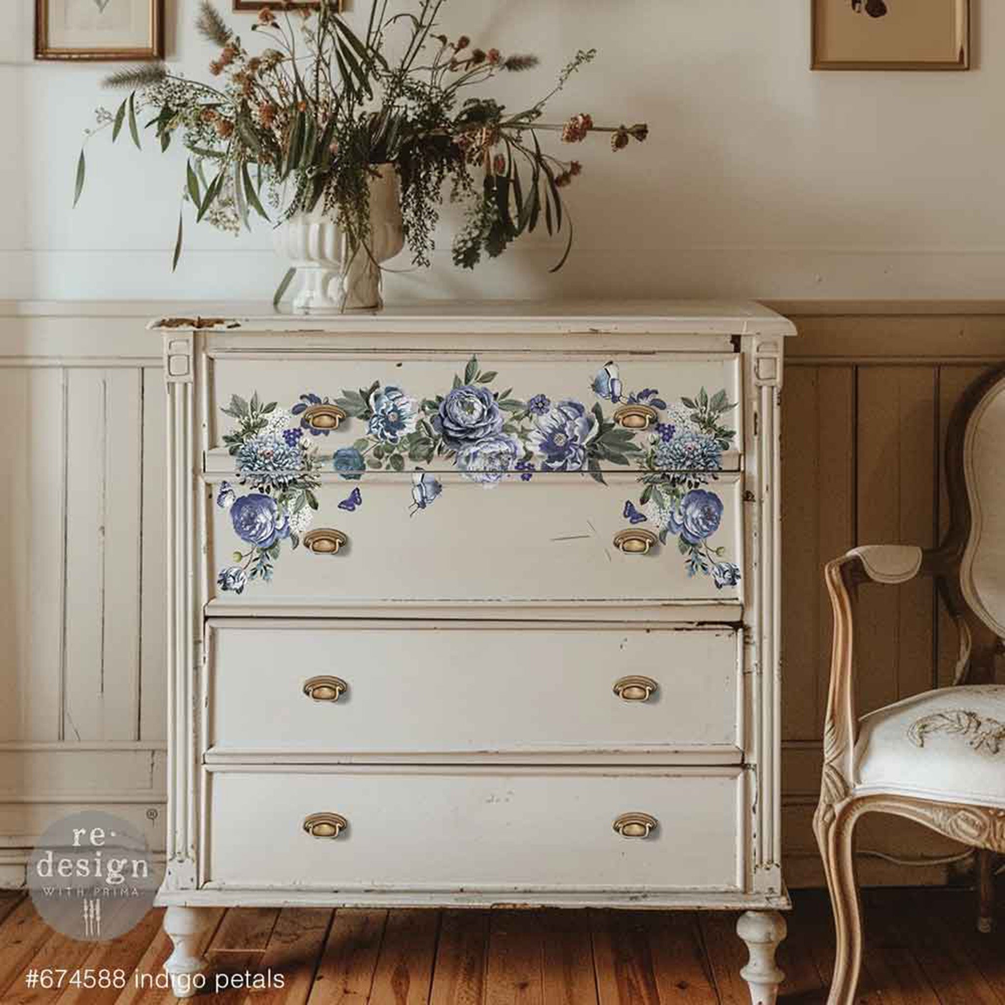 A vintage 4-drawer chest dresser is painted soft beige and features ReDesign with Prima's Indigo Petals small rub-on transfers on its top 2 drawers.