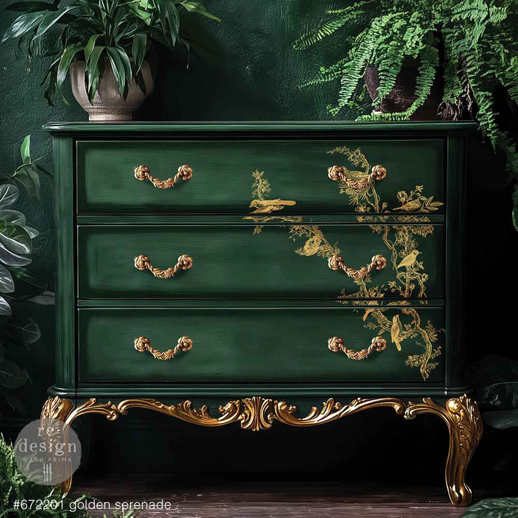 A vintage 3-drawer dresser is painted dark green with gold accents and features ReDesign with Prima's Kacha Golden Serenade Gold Foil small rub-on transfer on the drawers.