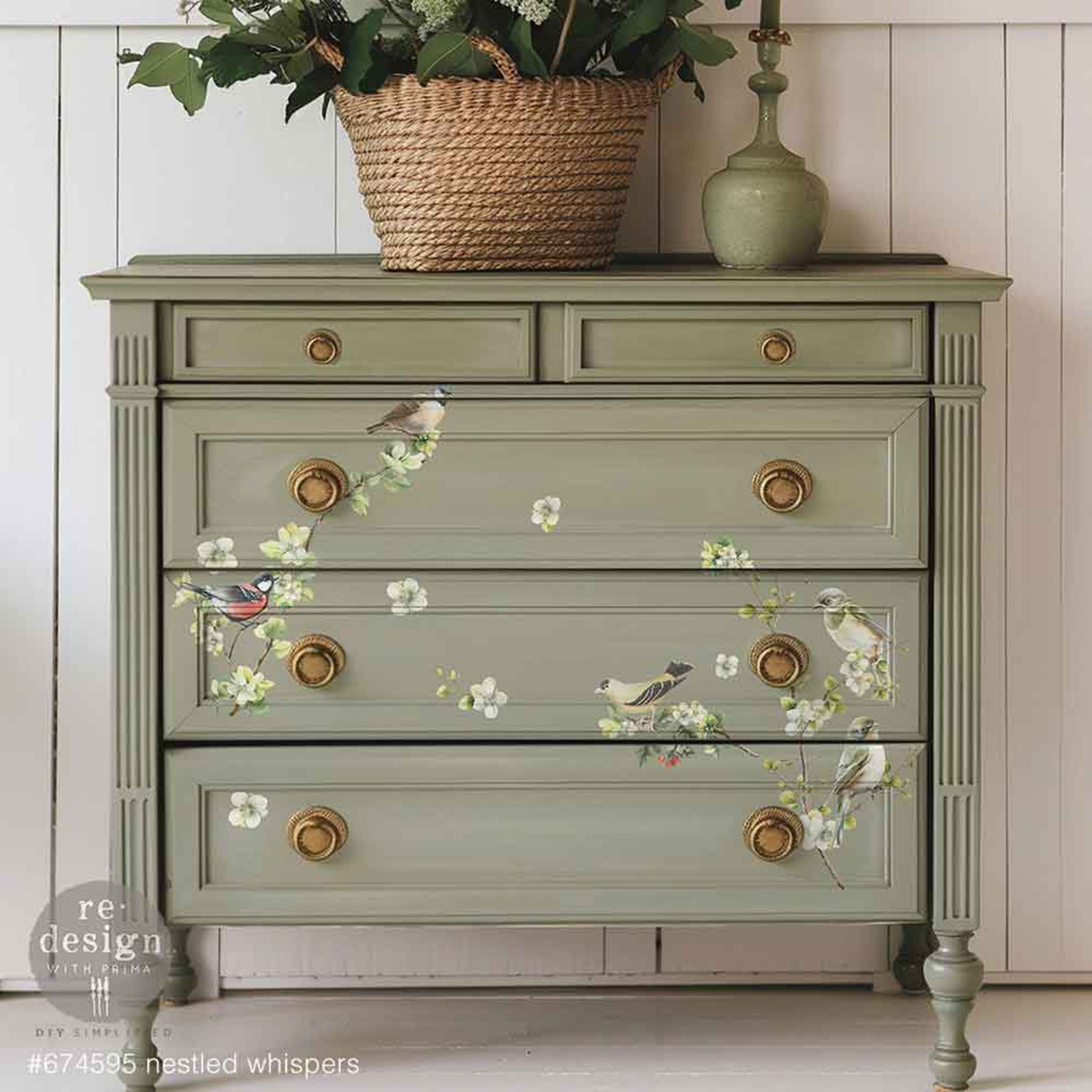 A 5-drawer dresser is painted a soft sage green and features ReDesign with Prima's Nestles Whispers small rub-on transfers on the bottom 3 large drawers.