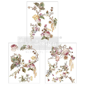 Three sheets of small rub-on transfers featuring blush roses intertwined with graceful vining greenery and delicate yellow flowers are against a white background.